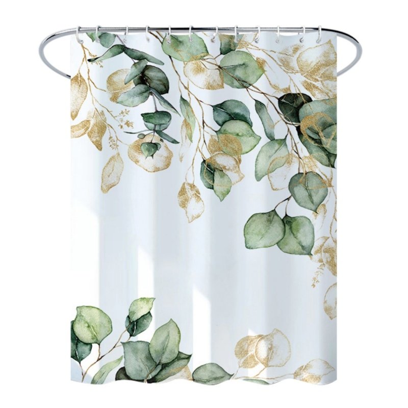 Close-up of green eucalyptus and golden vine print on white curtain