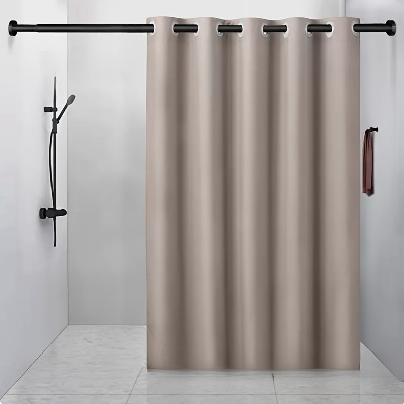 Grey linen-look shower curtain with large silver rings in modern bathroom