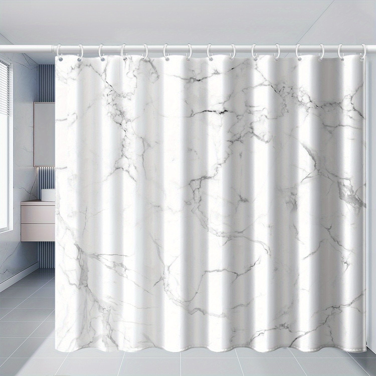 Marble print shower curtain styled in monochrome bathroom