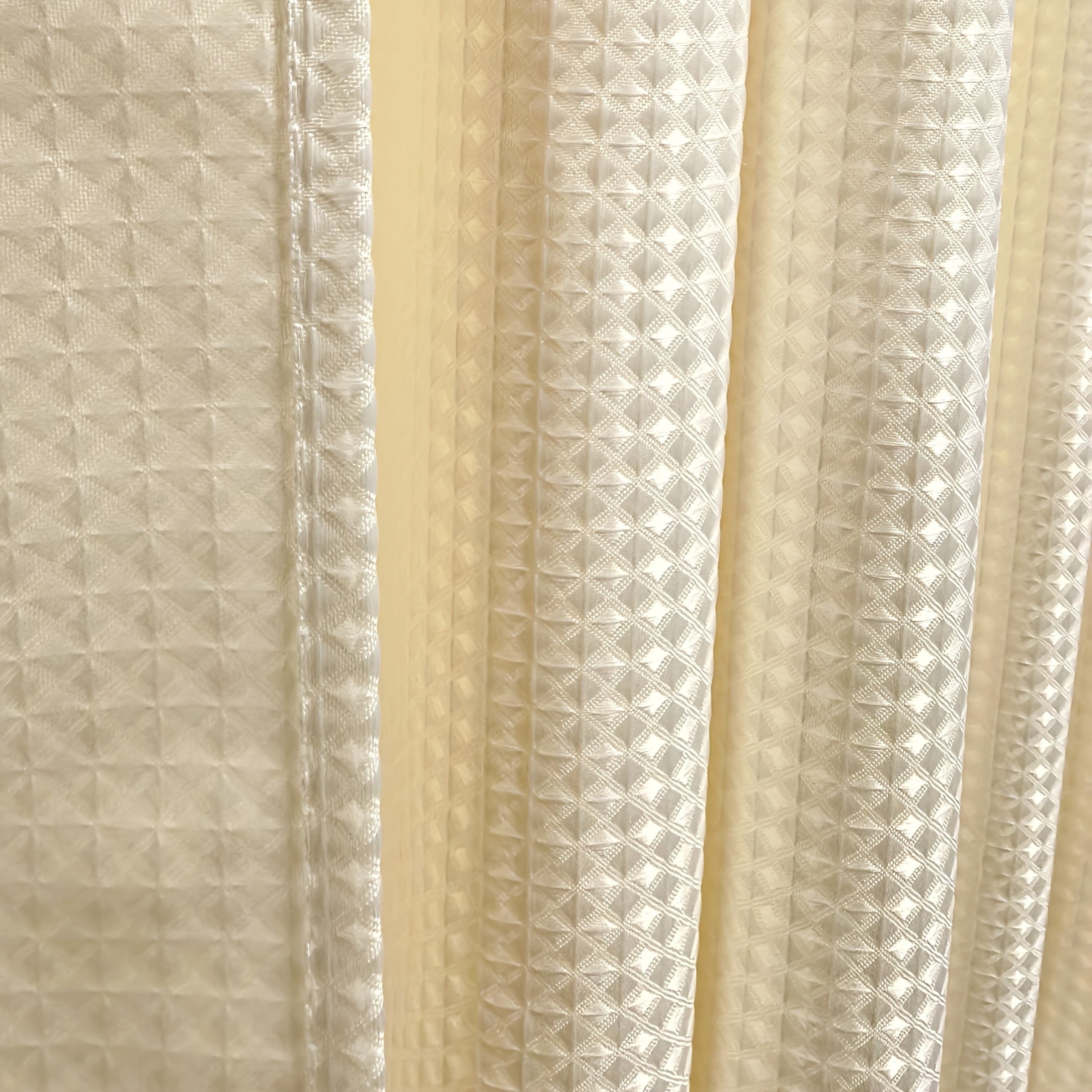 Light grey waffle weave shower curtain in neutral bathroom