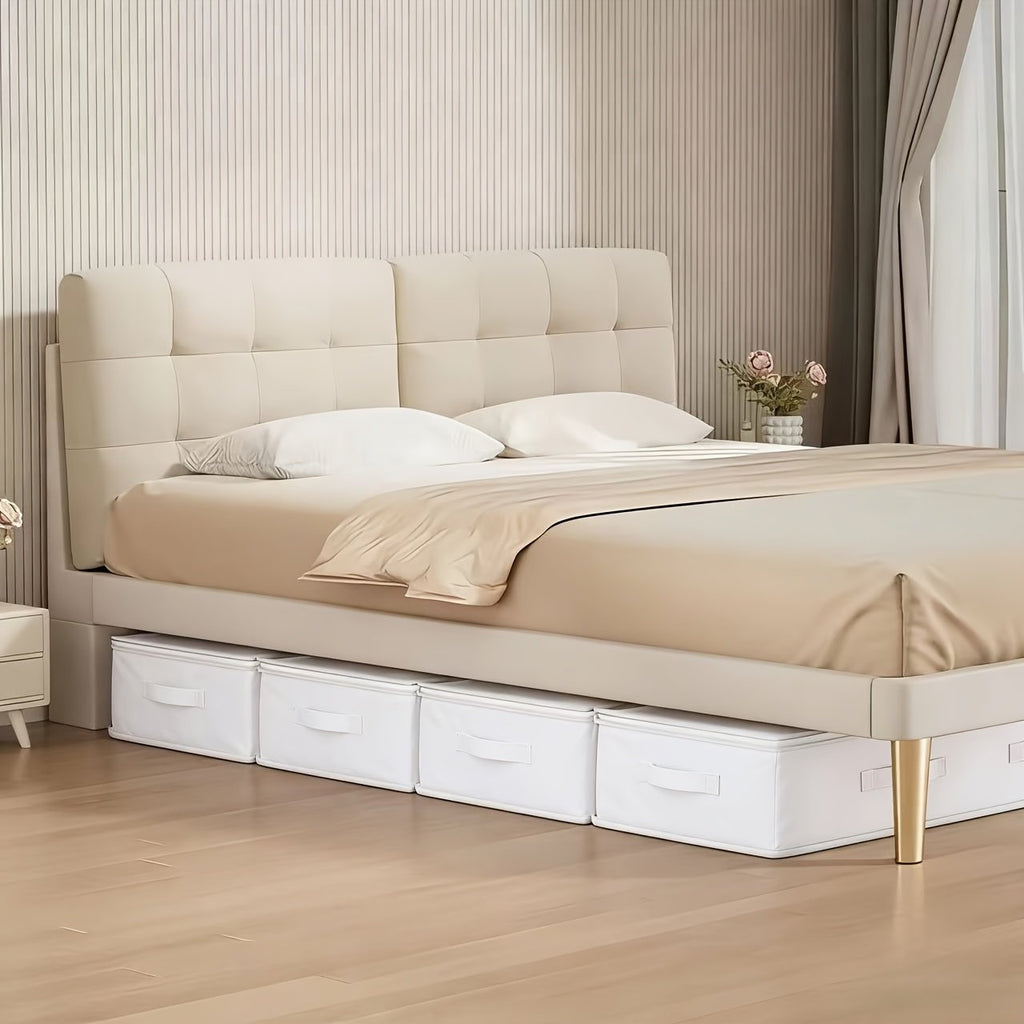 White underbed storage bag holding folded comforters and pillows
