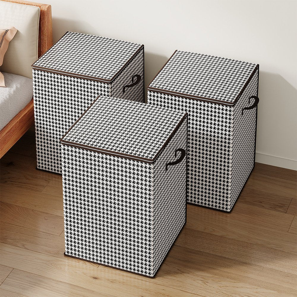 Houndstooth storage trunks stacked neatly in bedroom for seasonal storage