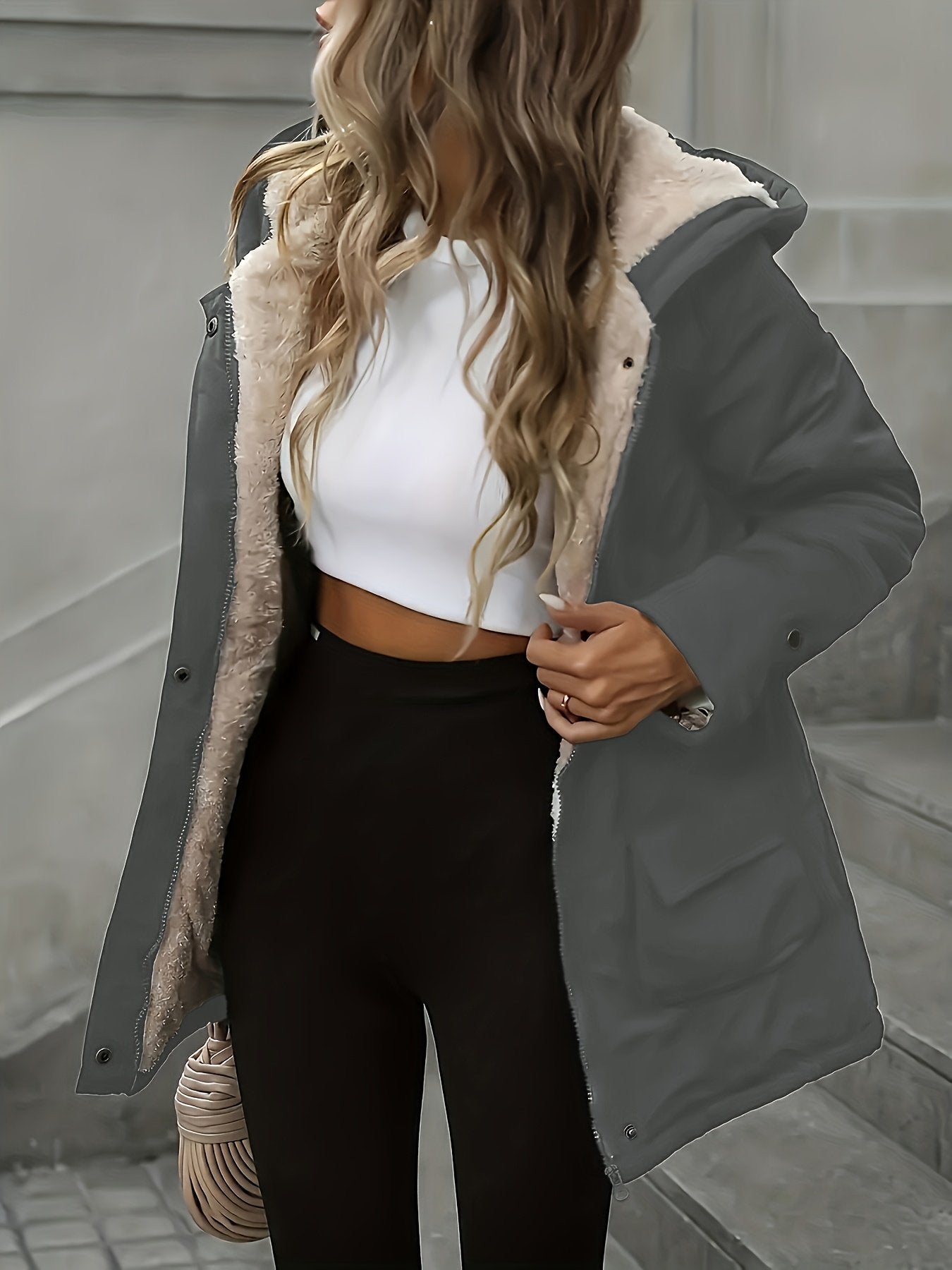 Grey hooded windbreaker for women worn with the hood up