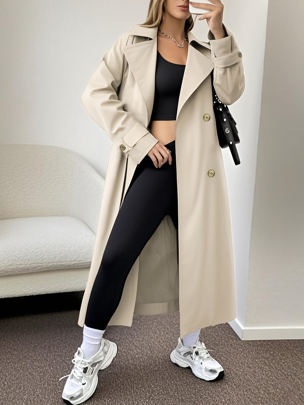 Women's black knee-length double-breasted trench coat, full-length front view
