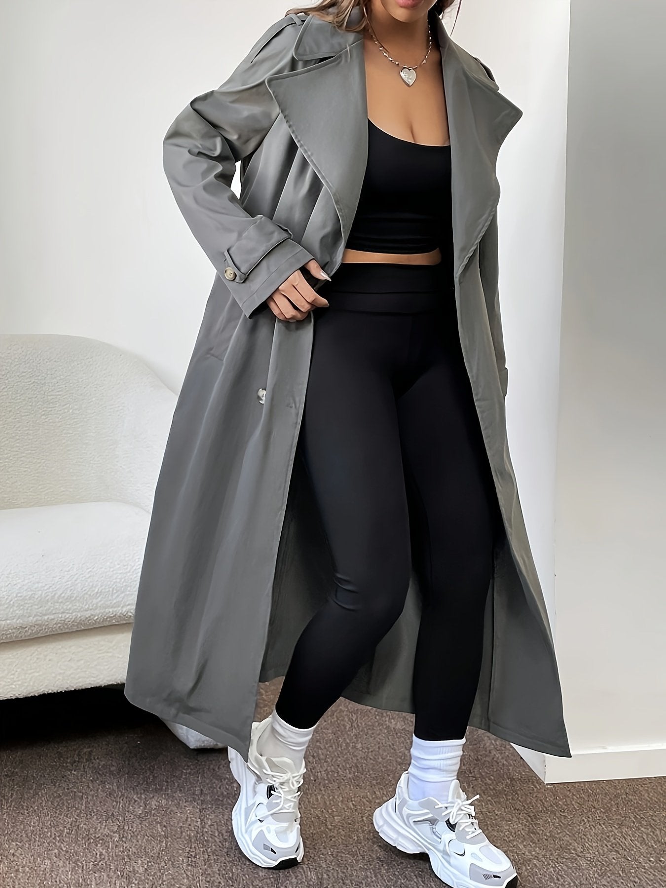 Army green knee-length trench coat for women shown buttoned up