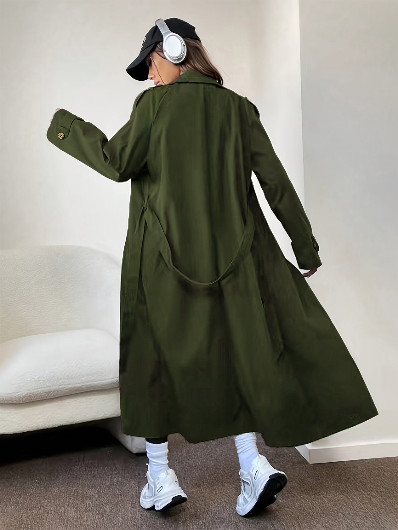 Back view of the classic British-style women's double-breasted trench coat