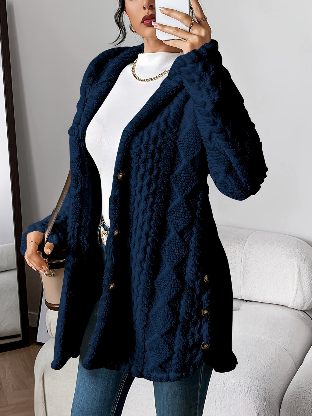 Close-up of the argyle jacquard plush pile on the women's coat