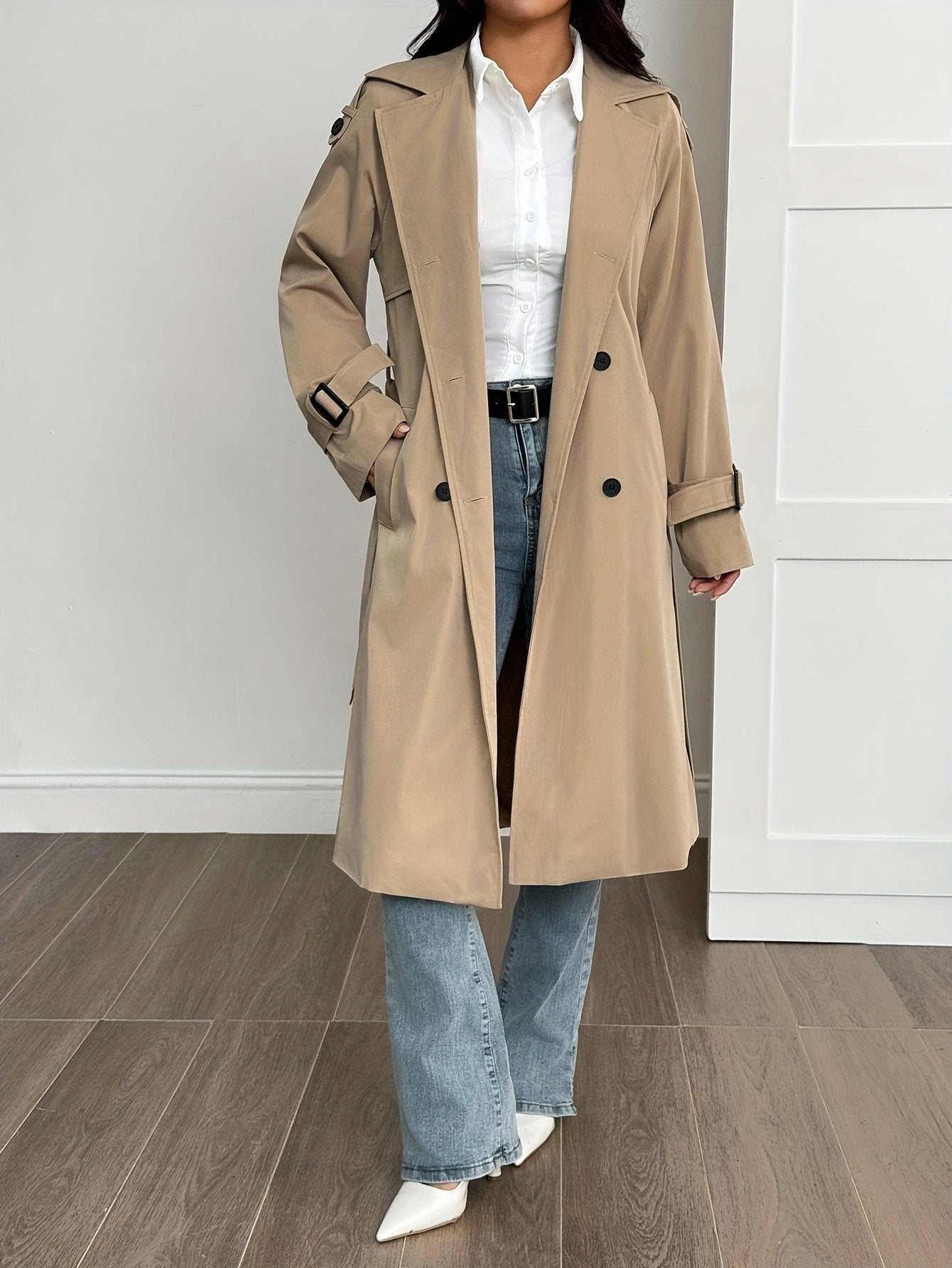 Khaki trench coat for women styled with the belt tied at the waist
