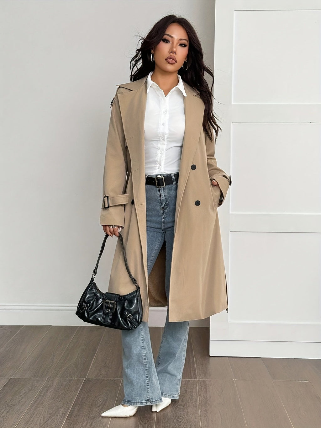 Belt and buckle detail on the women's mid-length warm coat