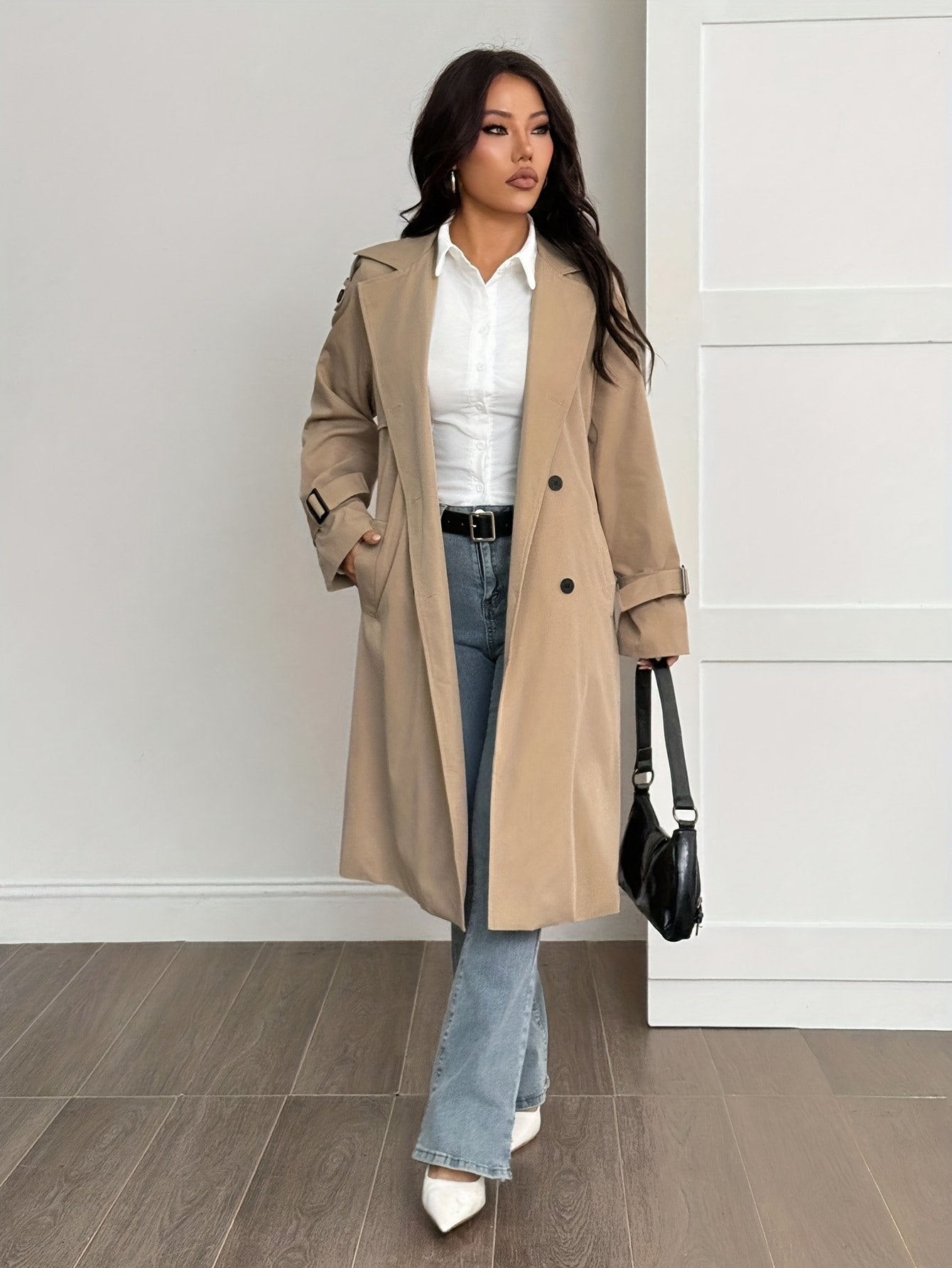 Side view of the women's khaki trench coat showing the mid-length cut