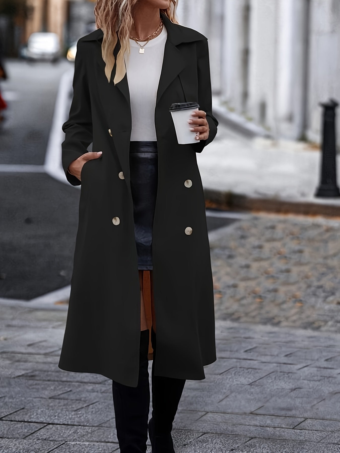 Black elegant trench coat for women styled with the tie belt fastened