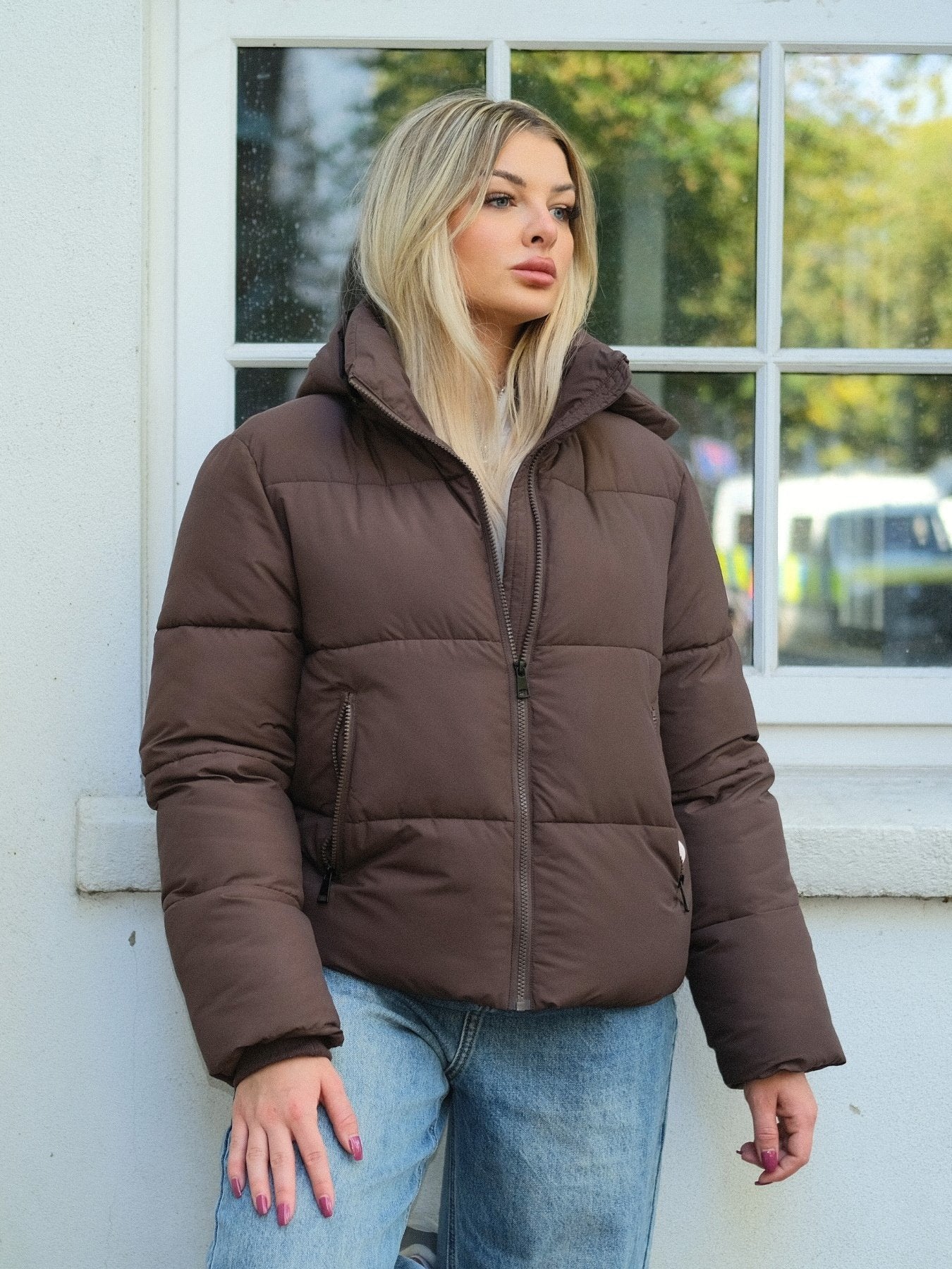Grey fitted puffer jacket for women with the hood attached