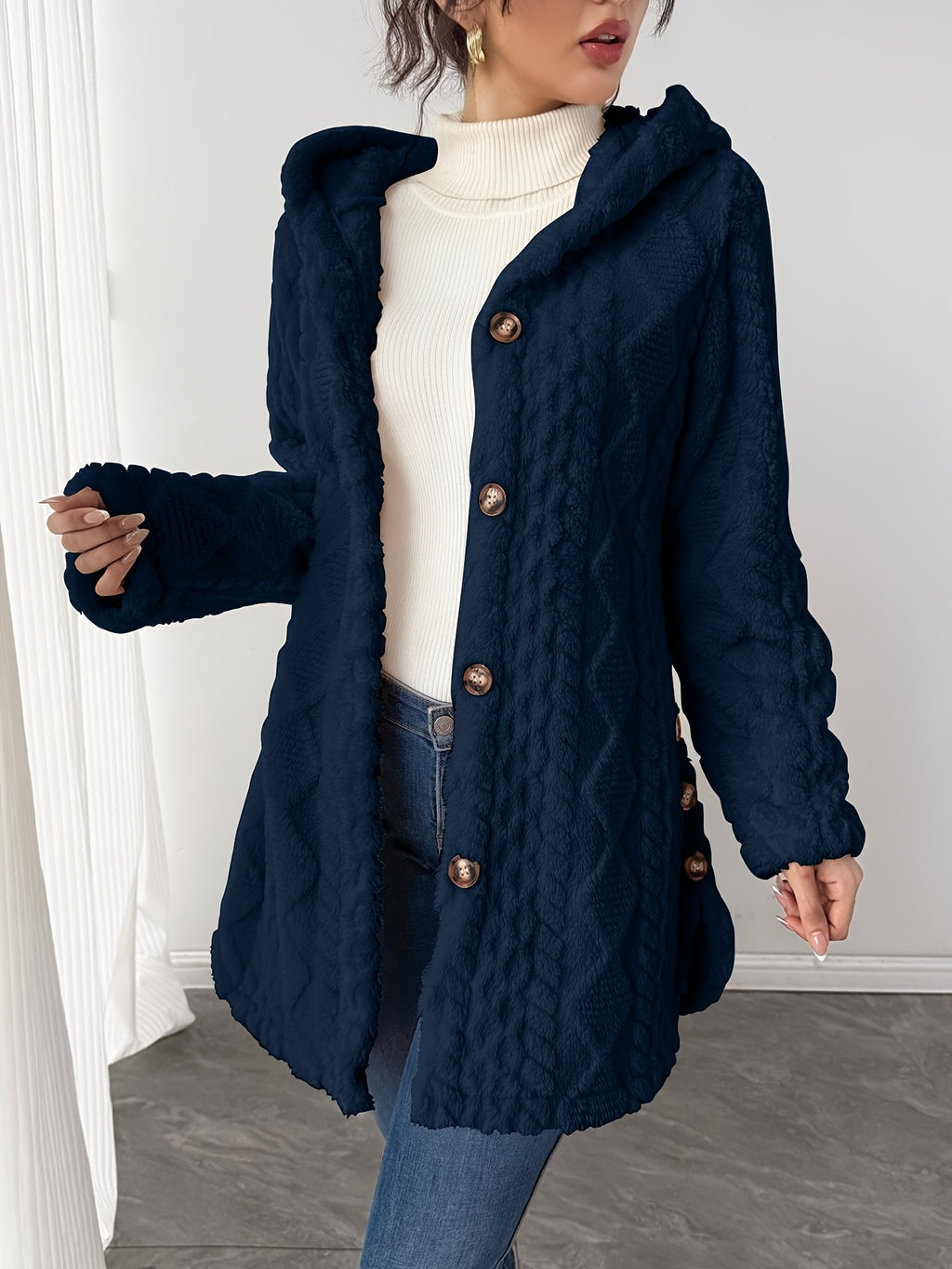 Side view of the mid-length cut on the women's teddy coat