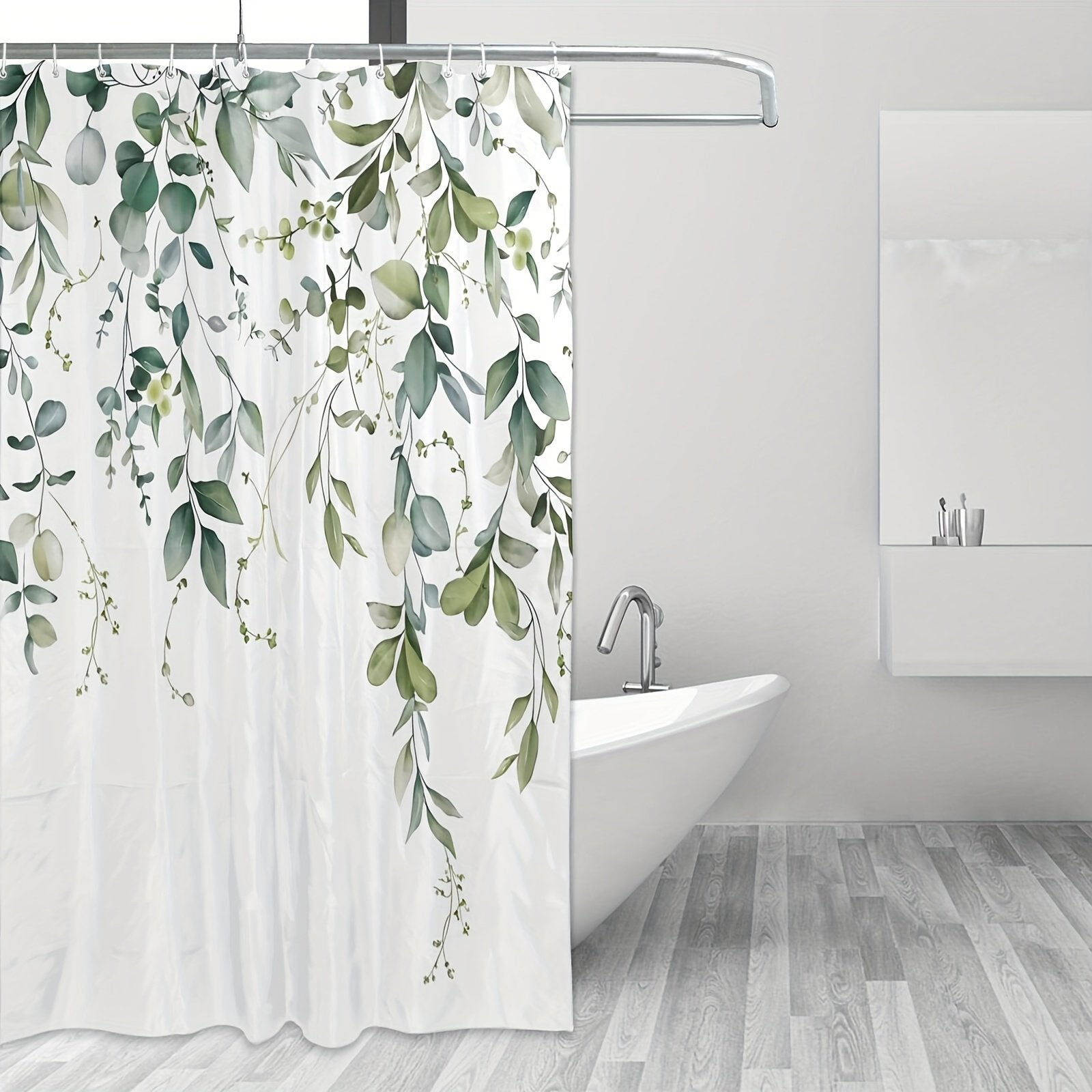 Botanical eucalyptus shower curtain hanging over bathtub