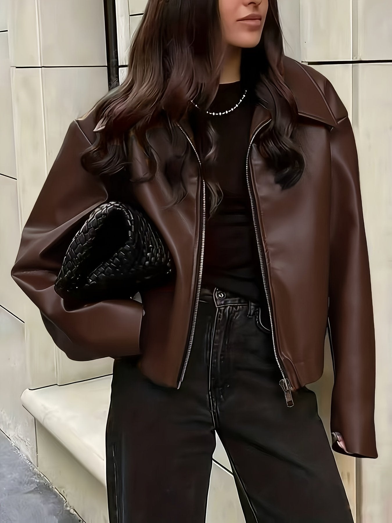 Close-up of the lapel collar on the women's faux leather jacket