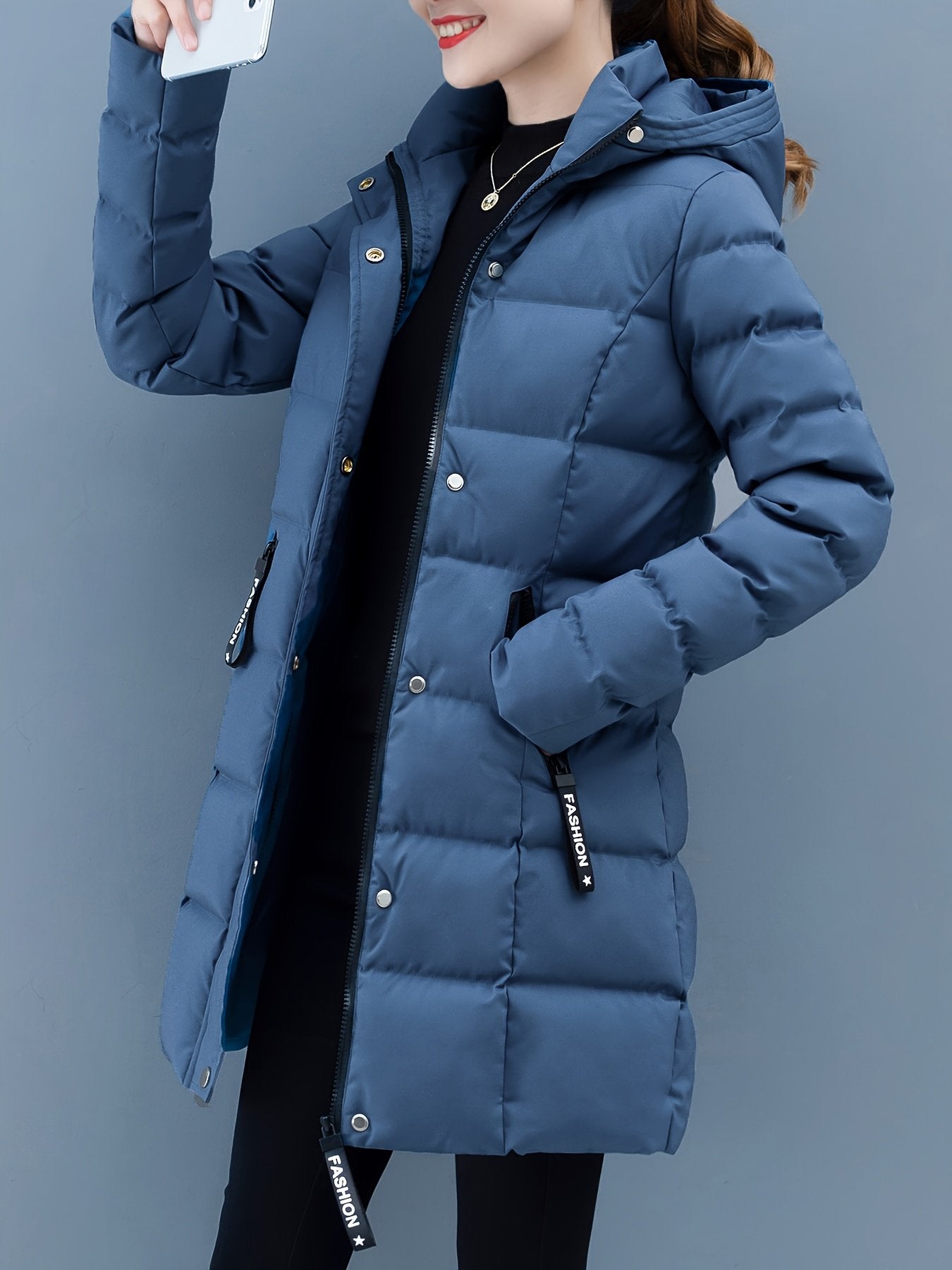 Women's red hooded padded mid-length puffer jacket, front view