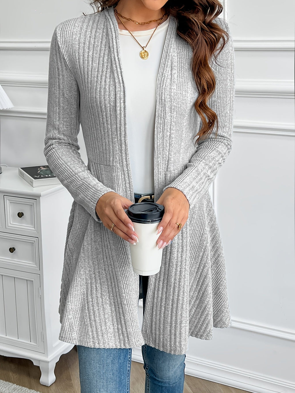 Black collarless loose fit jacket for women styled over a tee