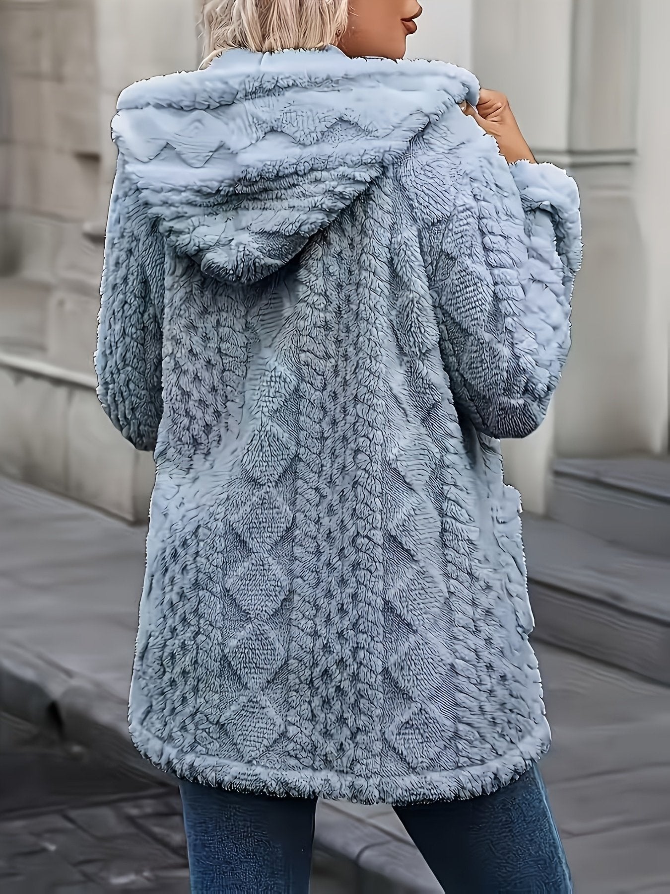 Hood and zip pull detail on the women's plush winter coat
