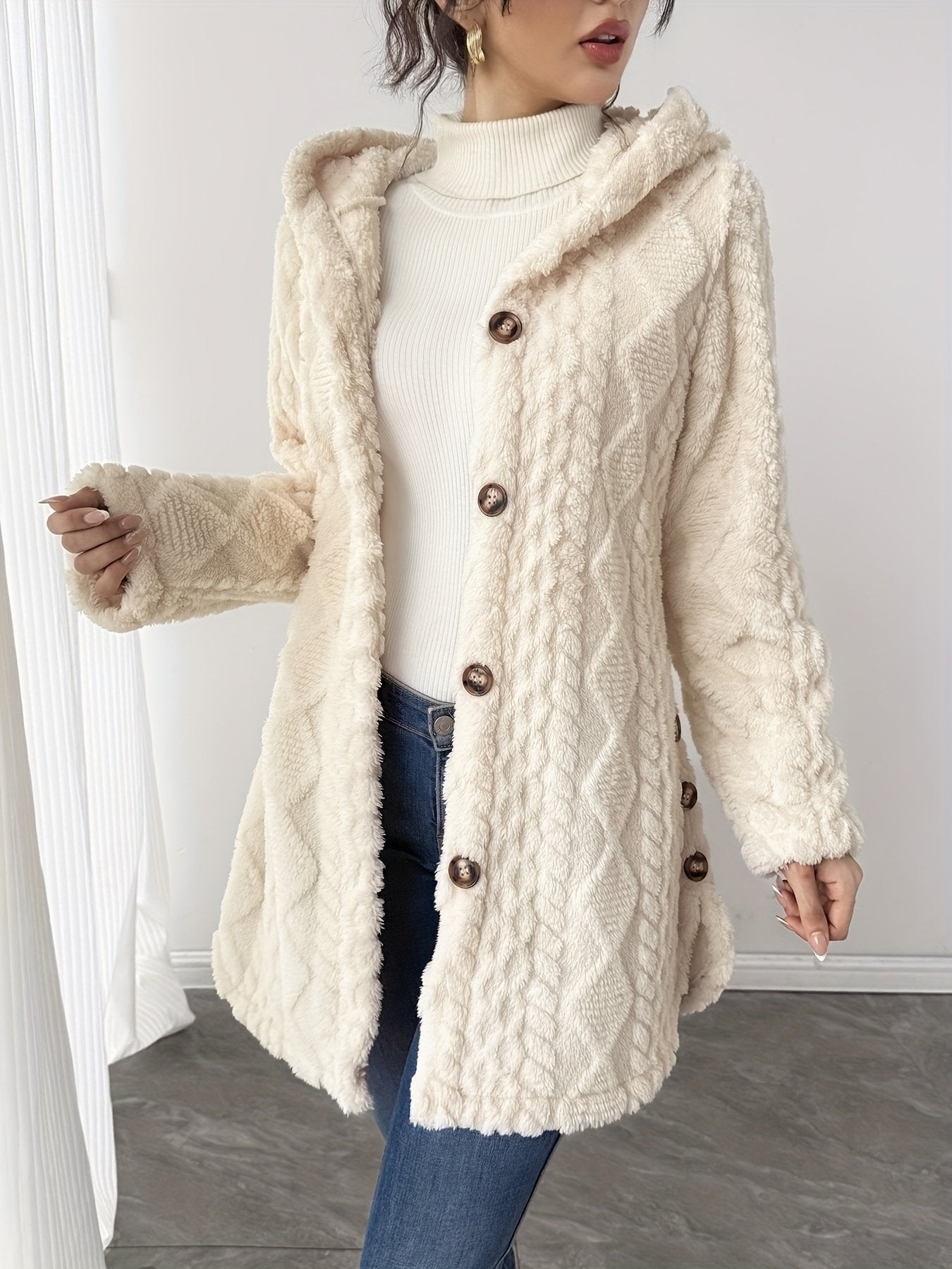 Button and pocket detail on the women's soft teddy coat