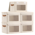 Five storage bins organising accessories on a closet shelf