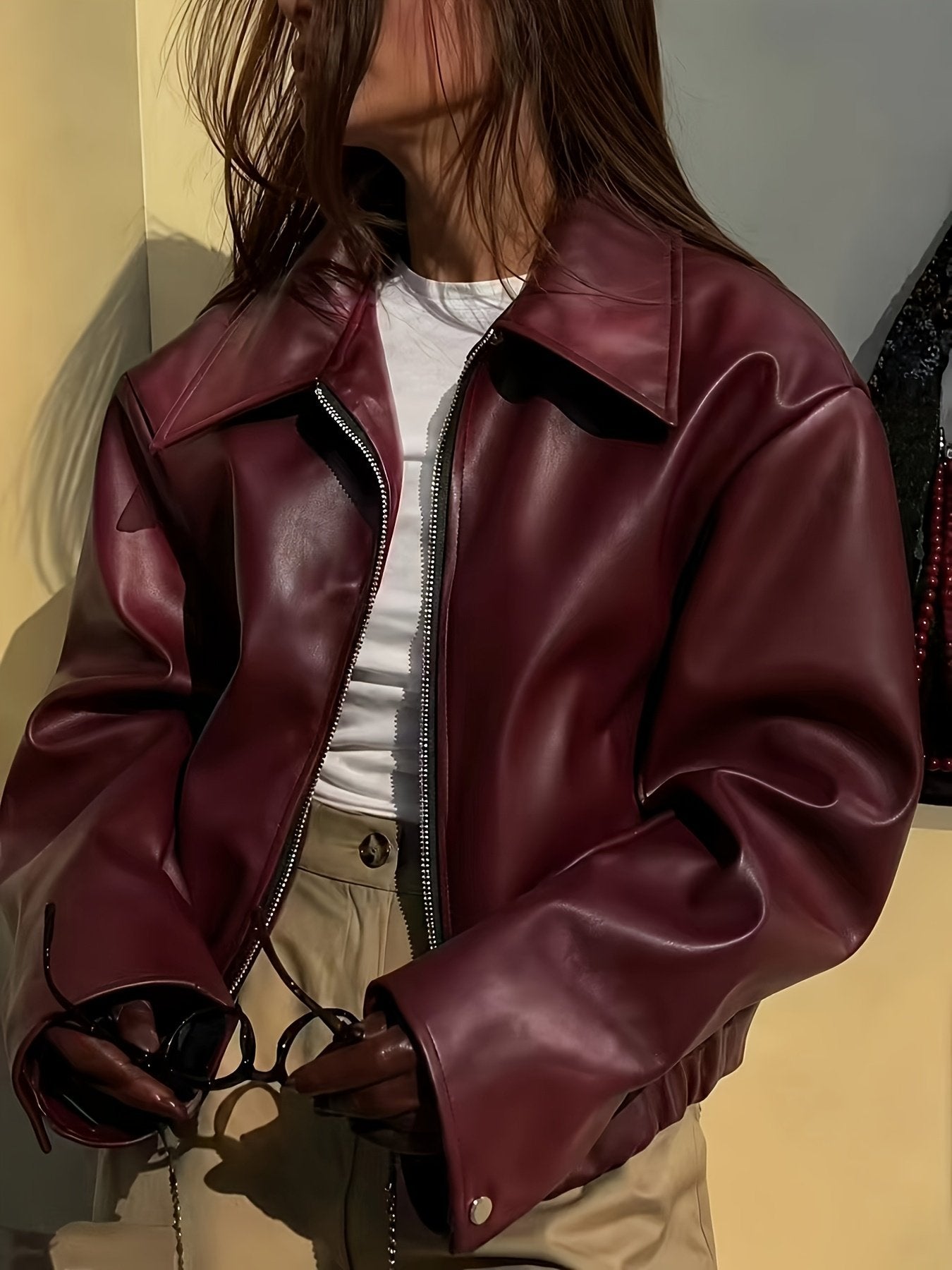 PU leather texture close-up on the women's chic jacket