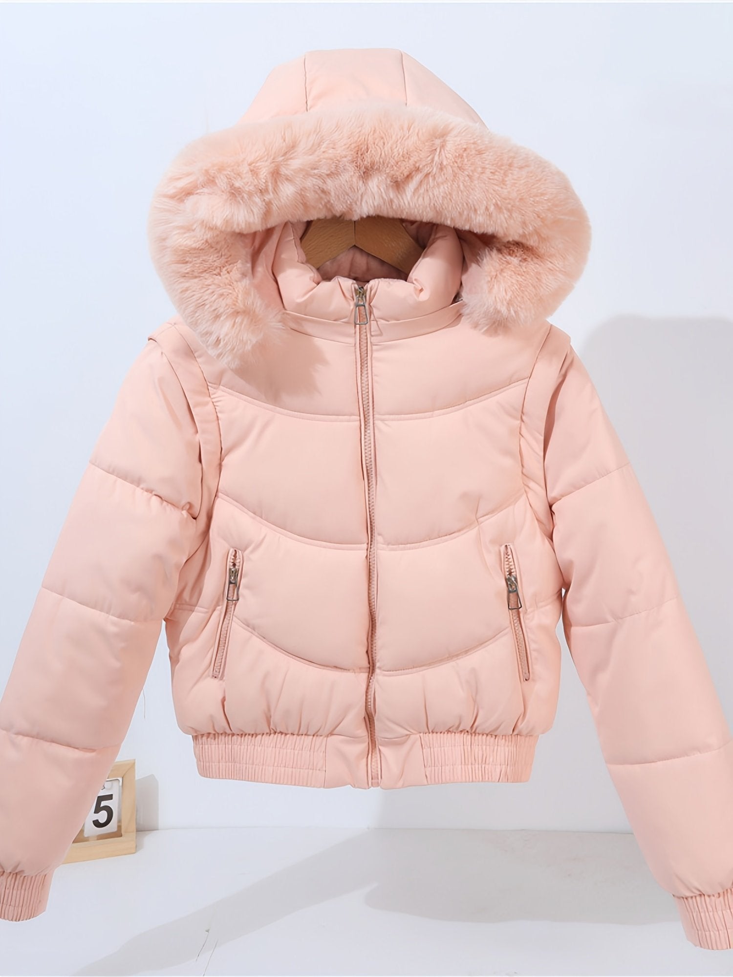 Large collar and hood detail on the women's padded coat