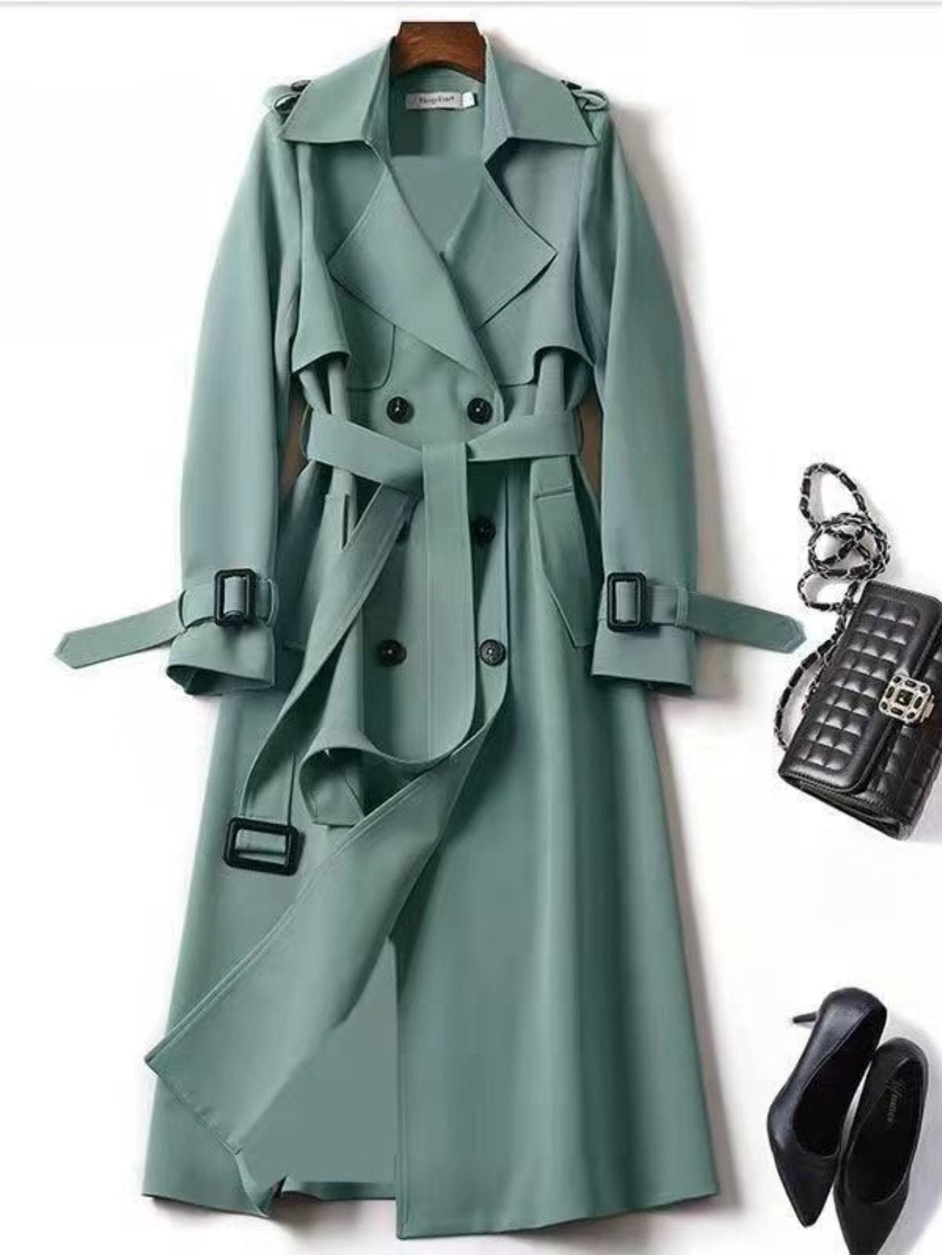 Waistband and belt detail on the women's elegant long trench