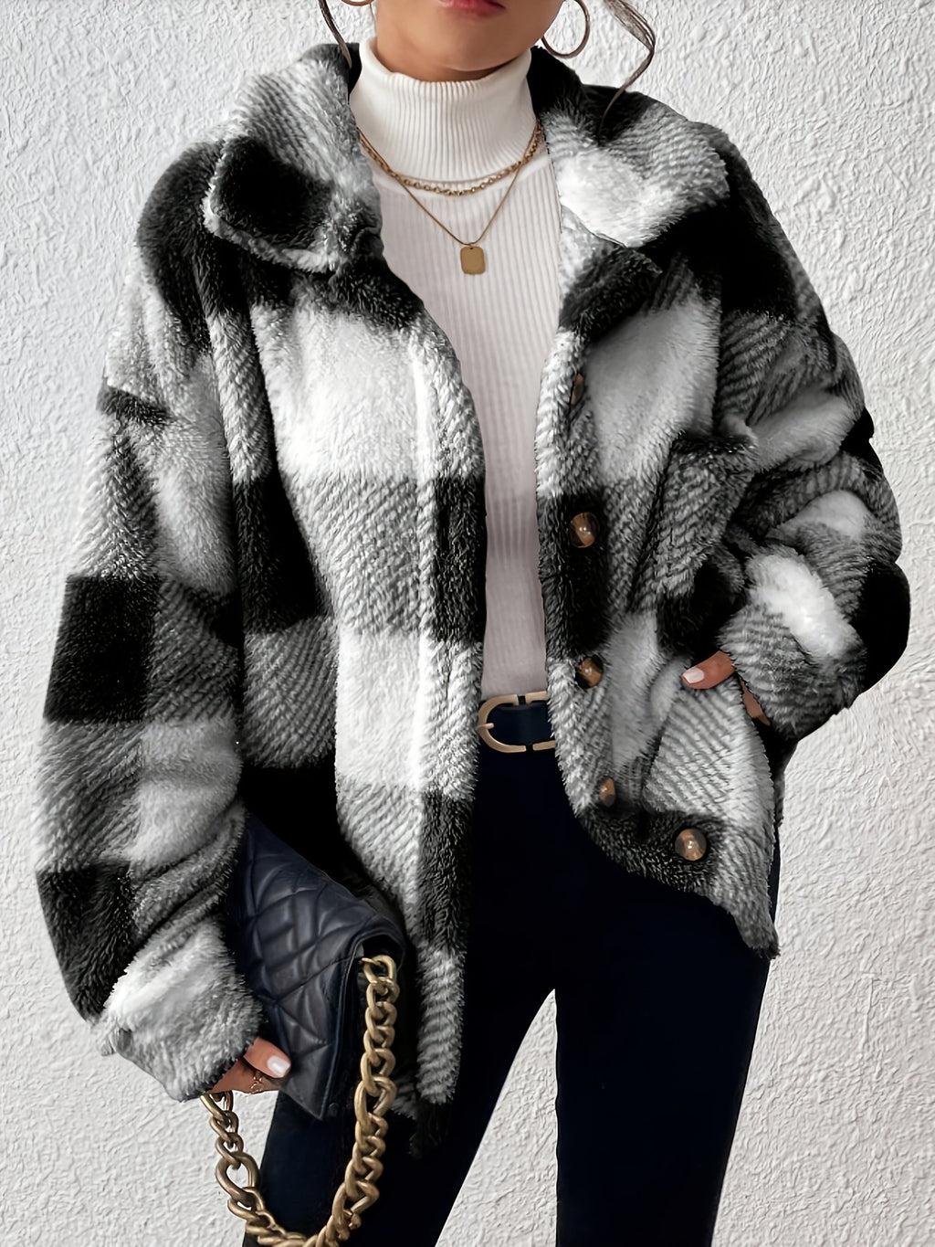 Close-up of the brushed plaid plush fabric on the women's jacket
