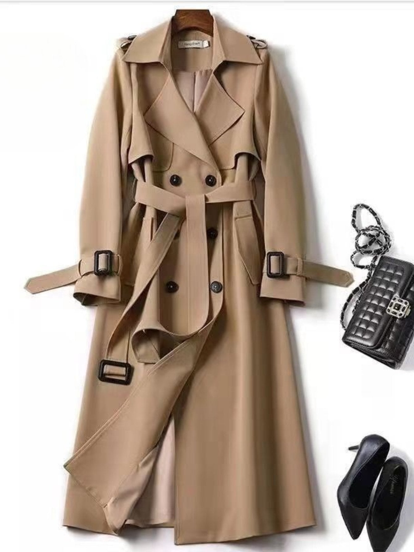 Back view of the women's long belted trench jacket in green