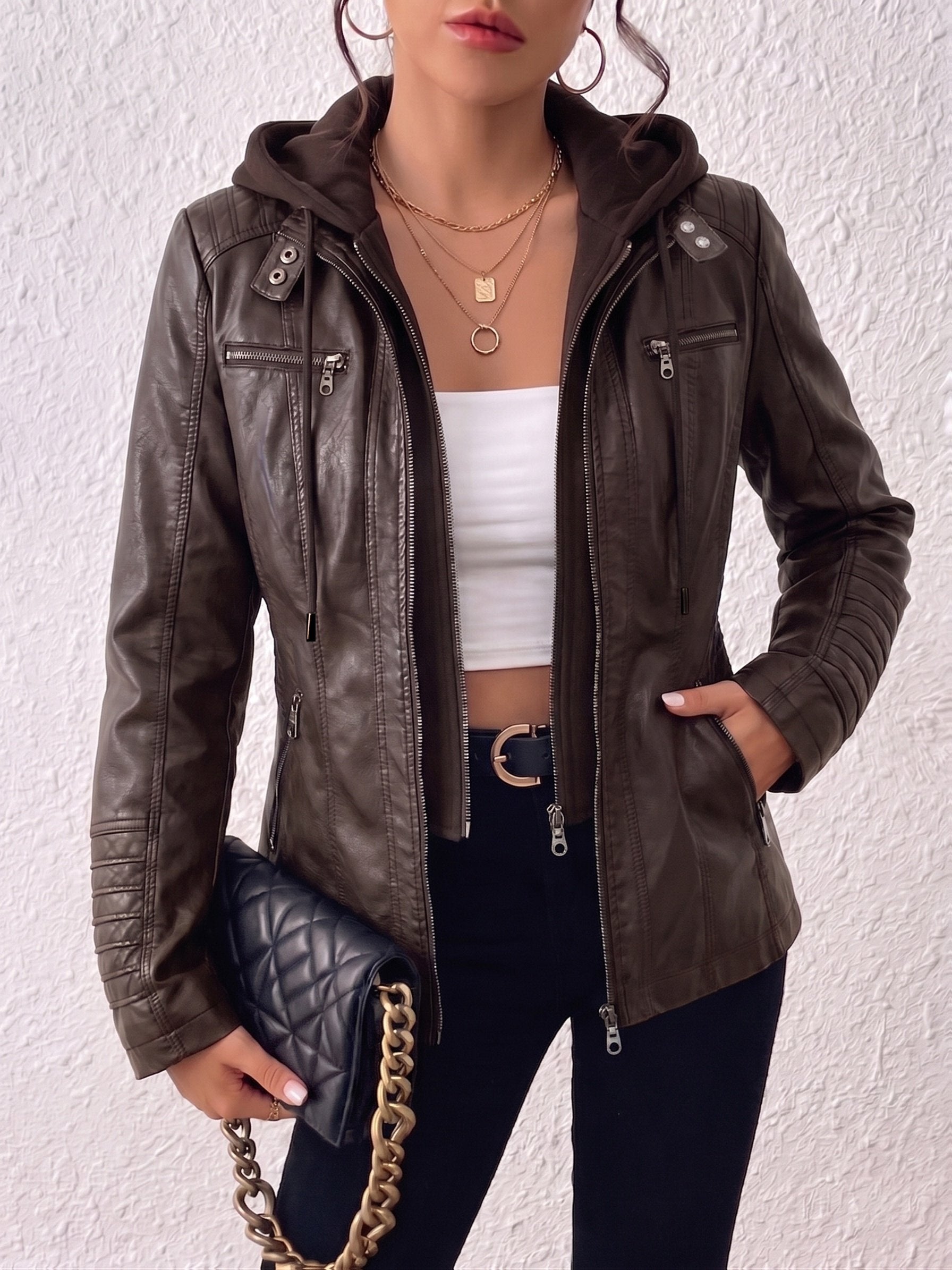 Back view of the women's black biker jacket with hood