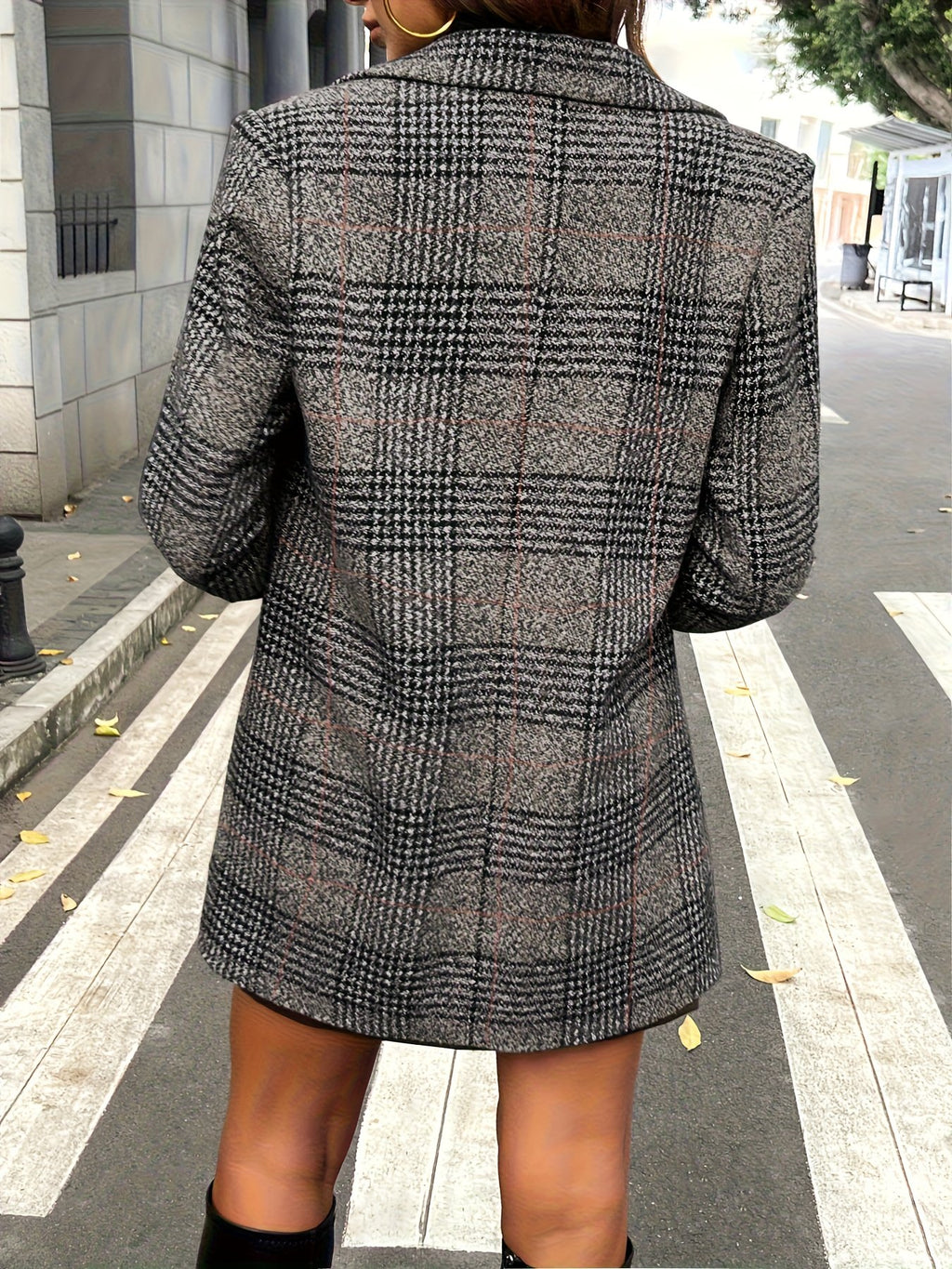 Close-up of the woven check pattern on the women's blazer coat