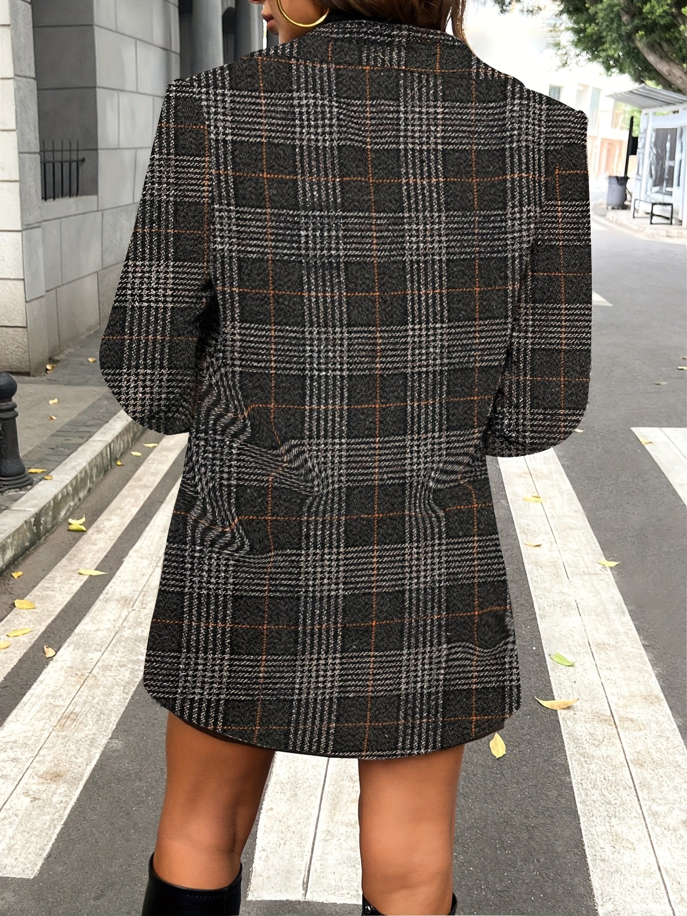 Lapel and button detail on the women's slim fit checked coat