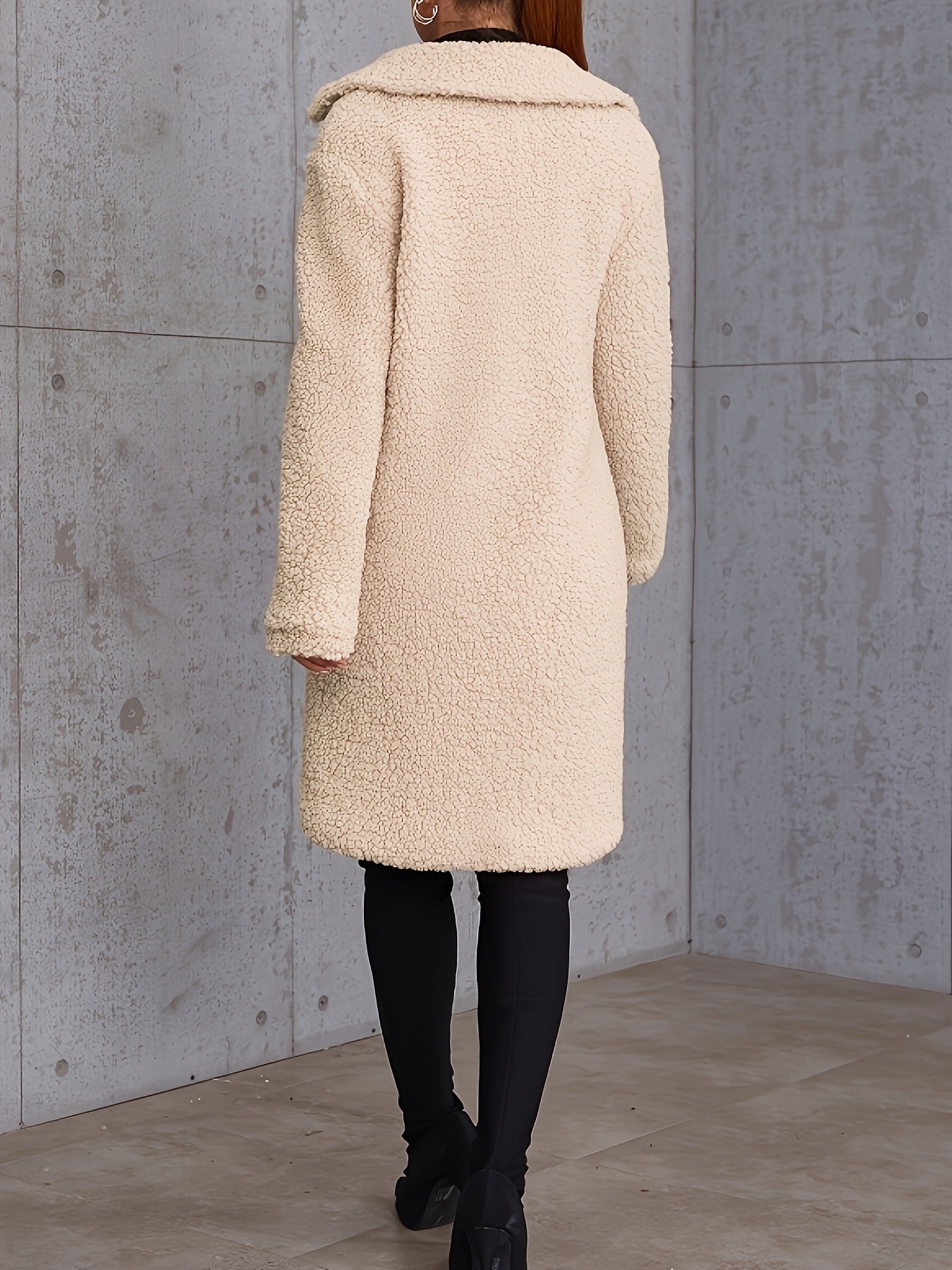 Close-up of the button front on the women's long winter coat