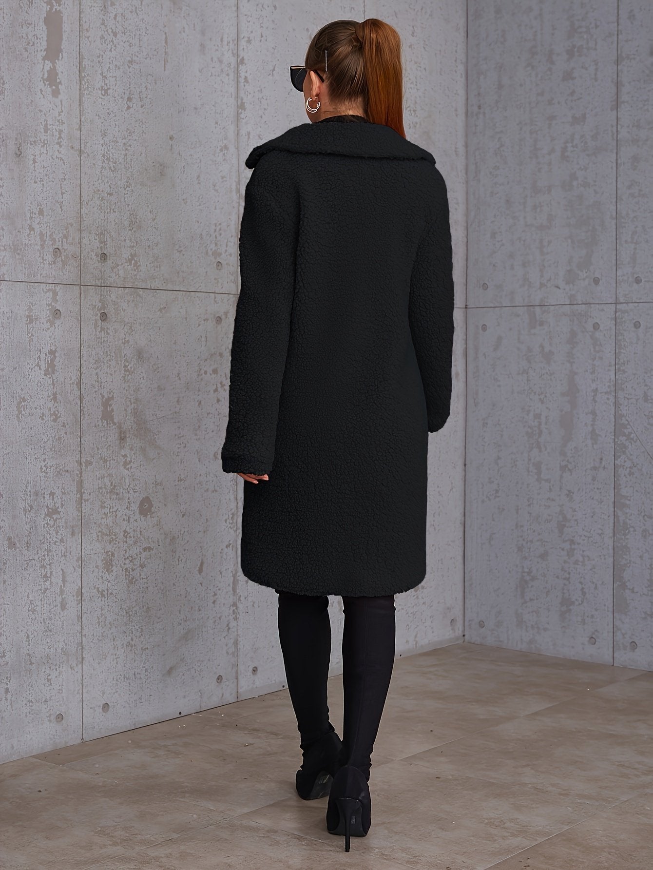 Side view of the long cut on the women's winter coat