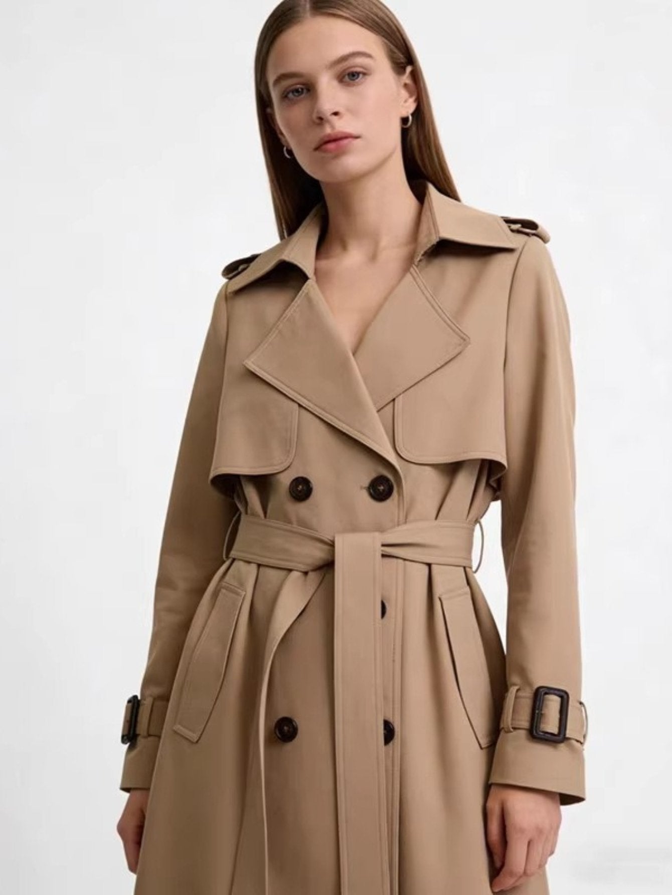 Close-up of the V-neck button placket on the women's trench jacket