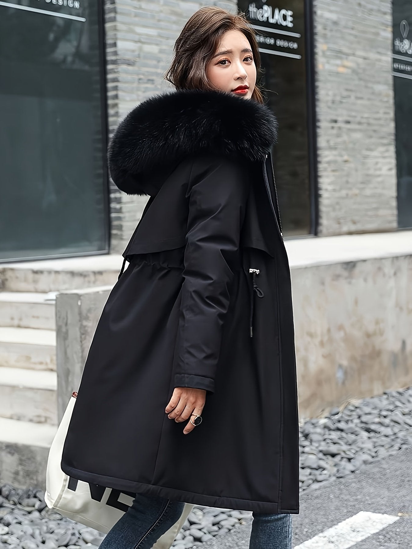 Detachable hood detail on the women's cold-proof winter coat