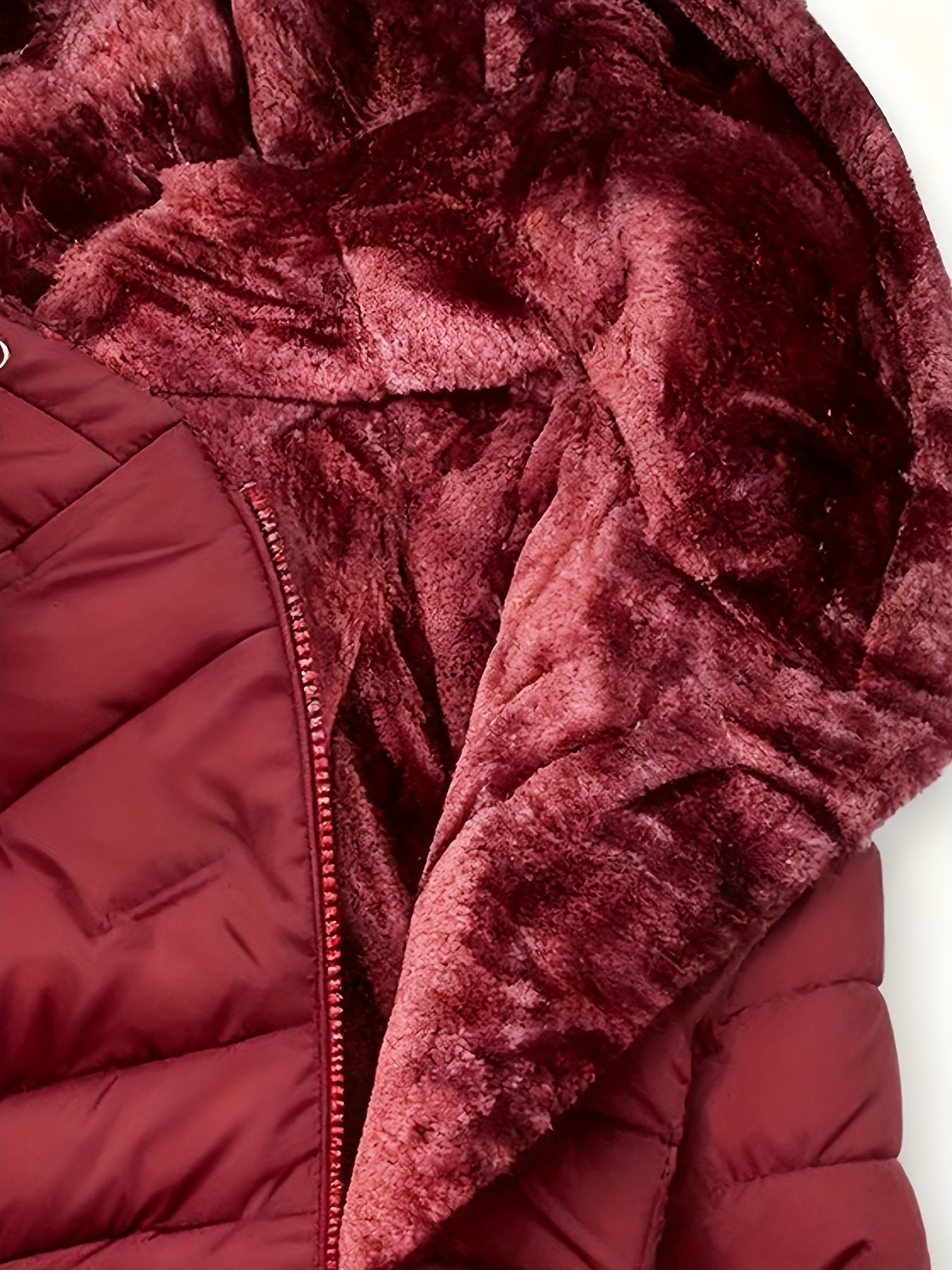 Close-up of the plush hood trim on the women's padded coat