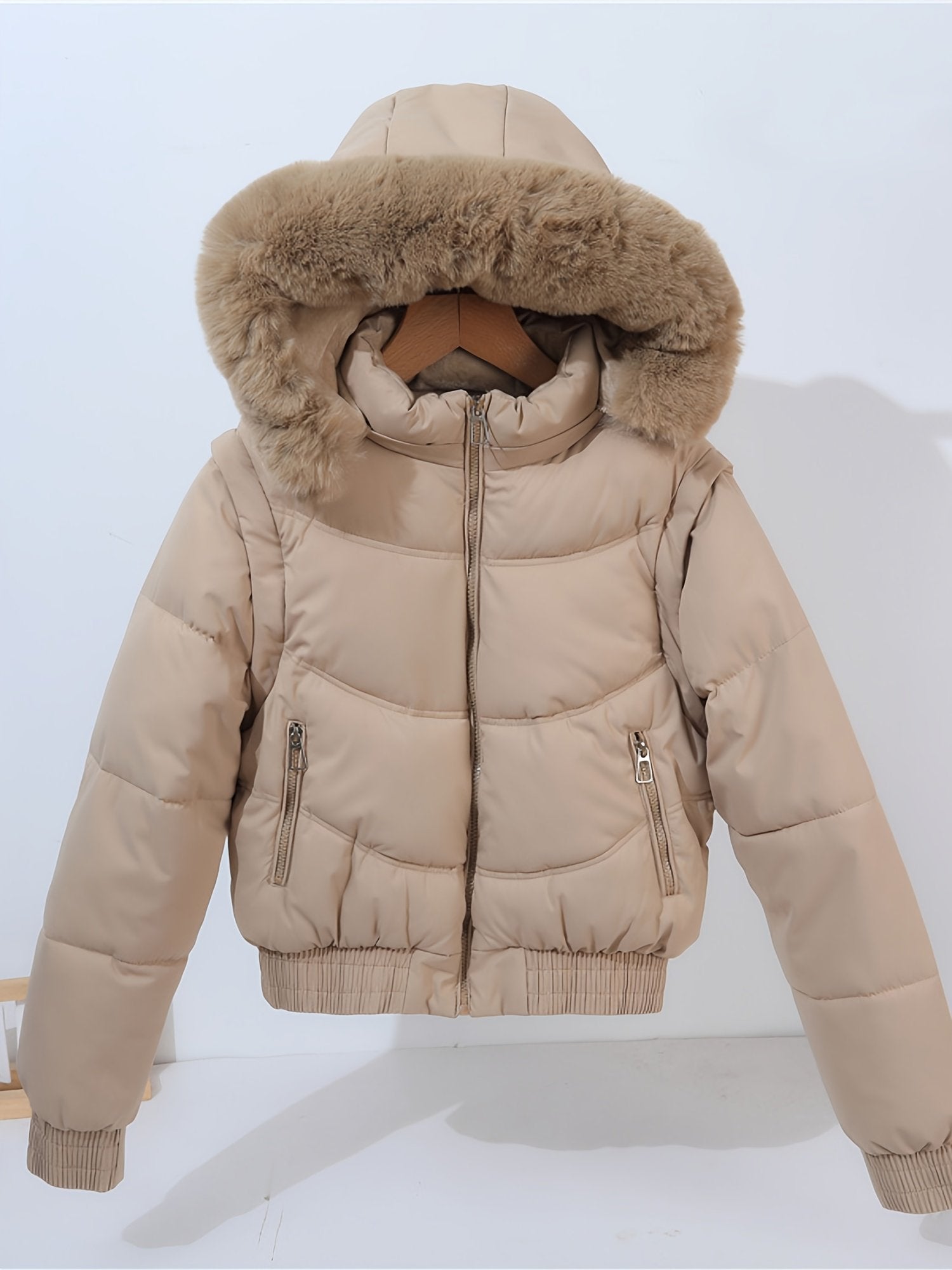 Women's pink padded coat with detachable sleeves, front view
