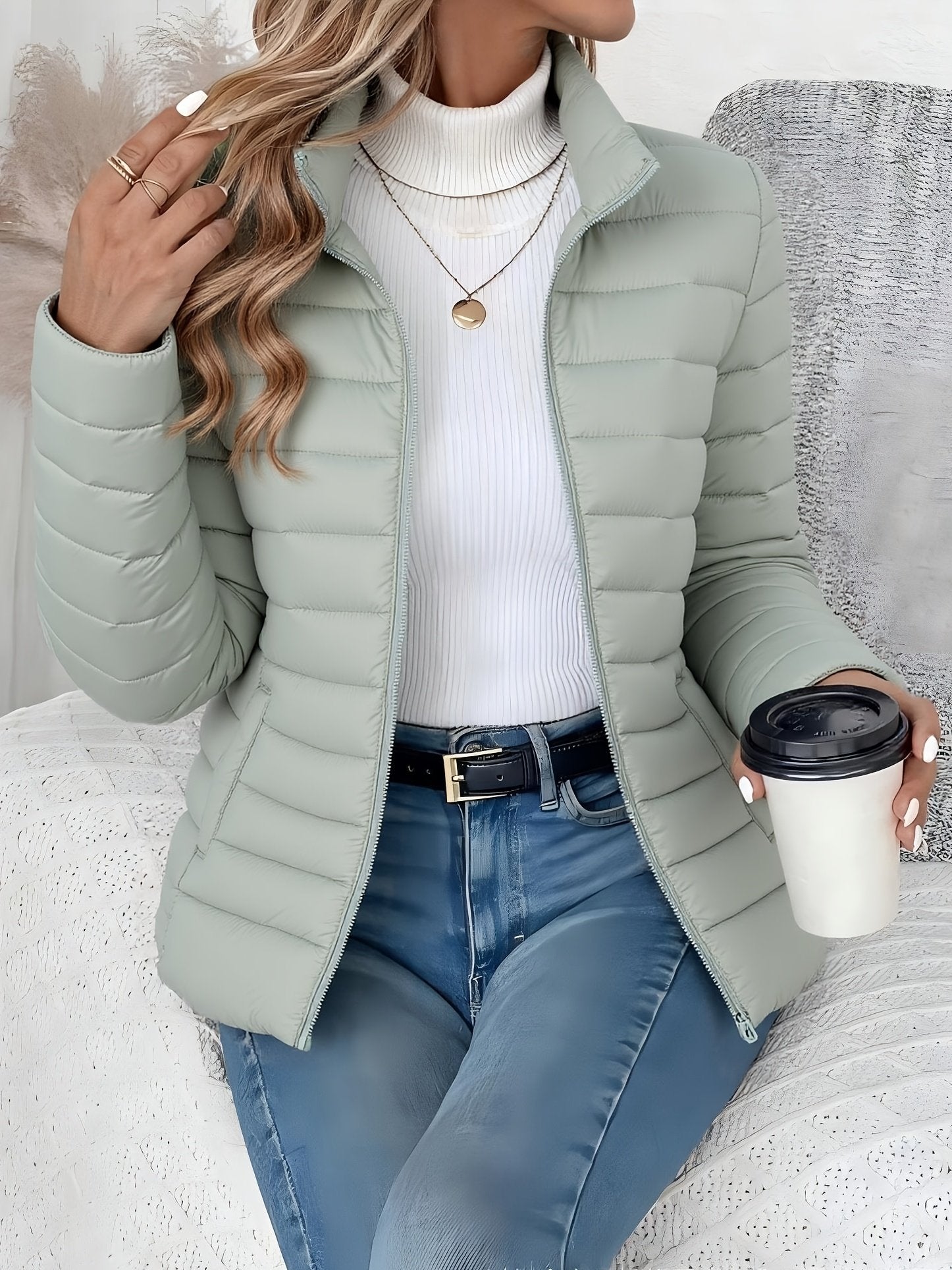 Women's peacock blue quilted cropped jacket with stand collar, front view