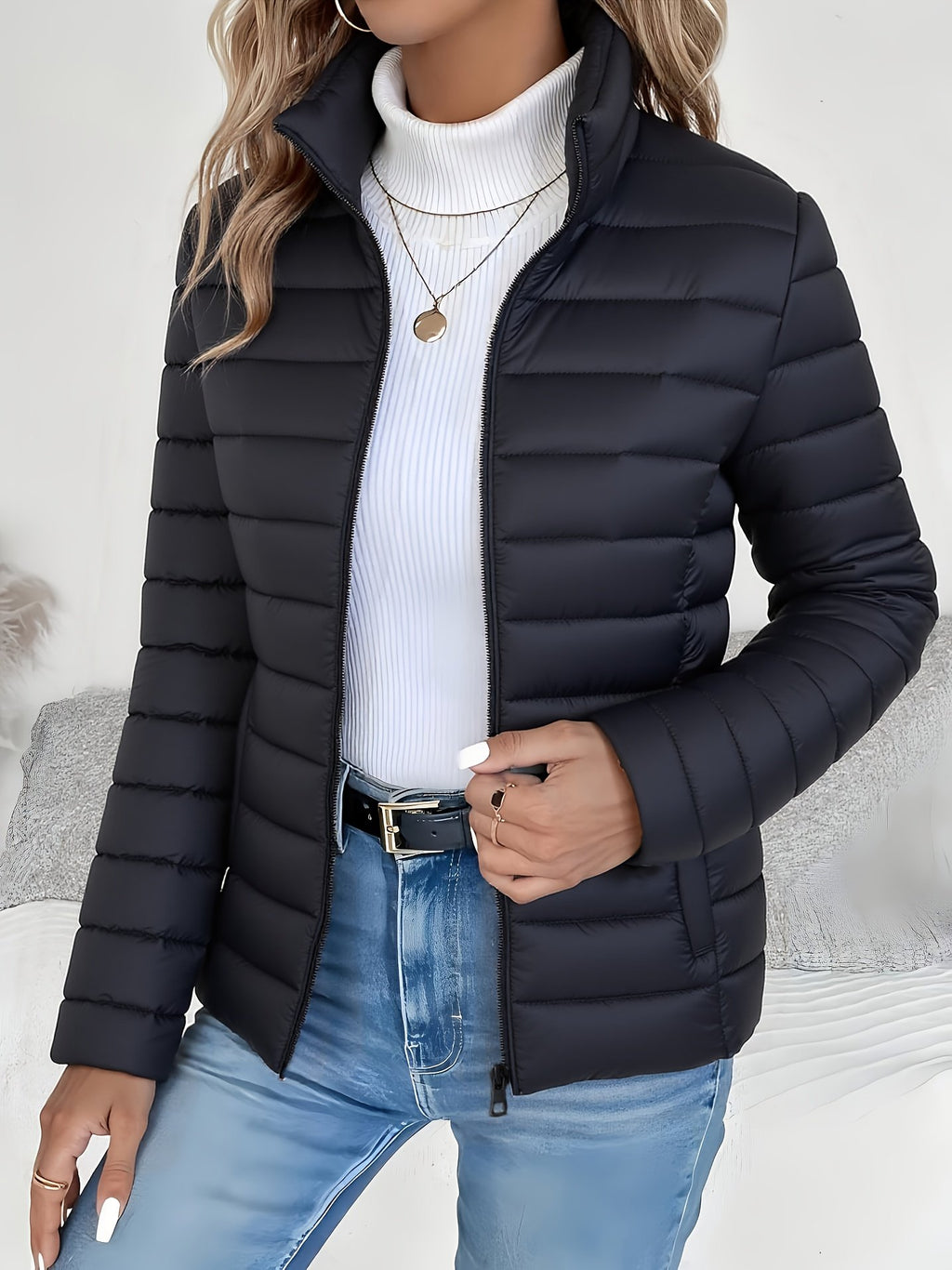Stand collar and zip detail on the women's lightweight padded jacket