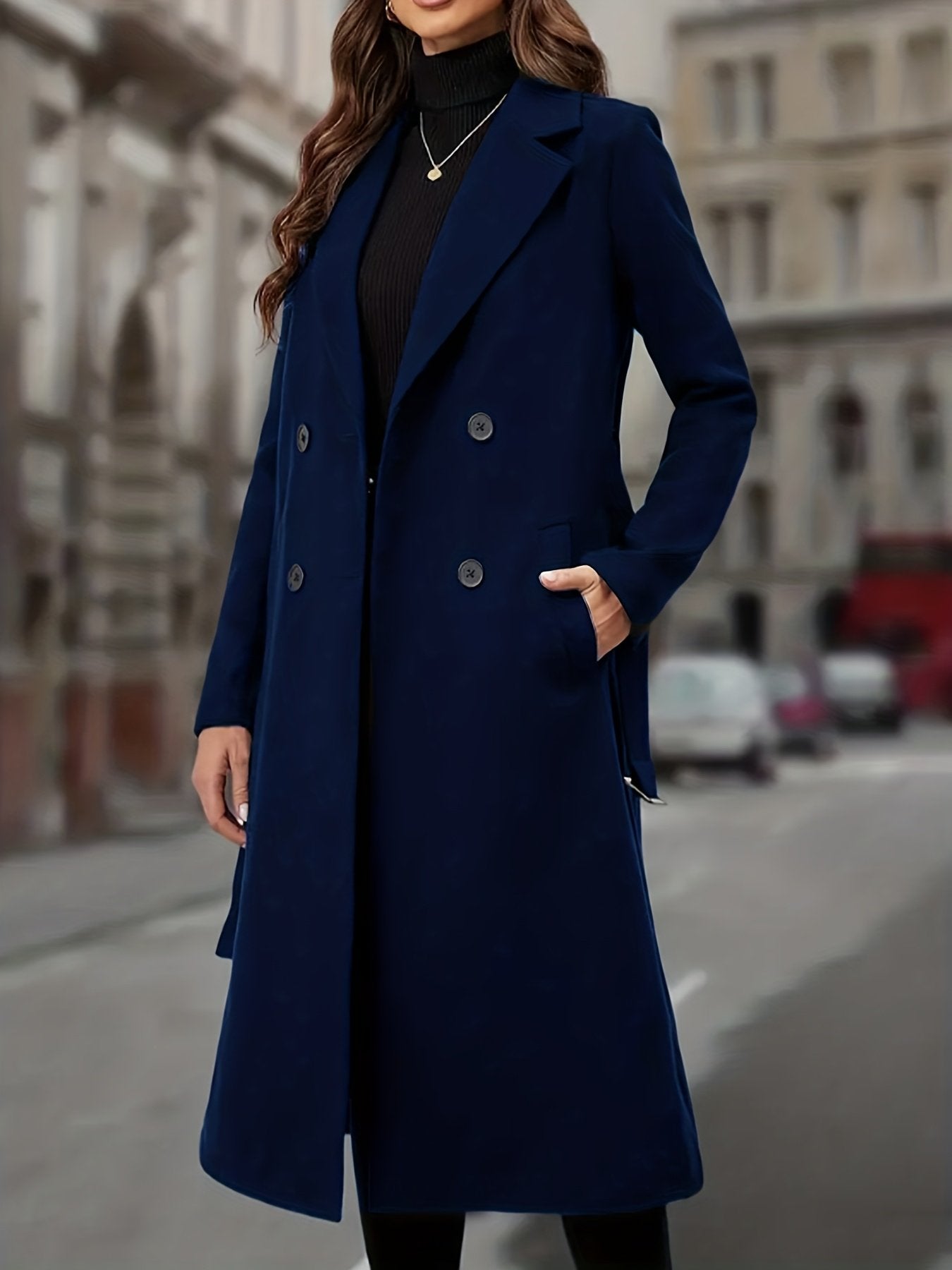 Dark grey women's double-breasted trench coat styled for a British winter commute